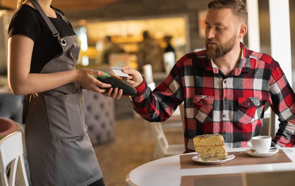 Customer paying at restaurant POS