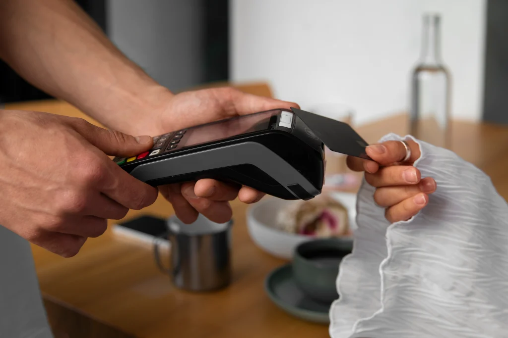 side-view-customer-paying-with-nfc-device
