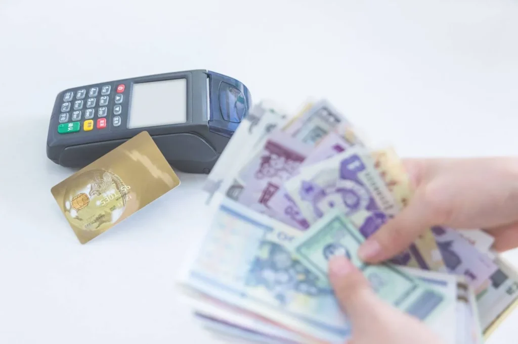 cash and credit card on white background