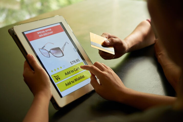 Customer making an online purchase using an integrated POS and payment system