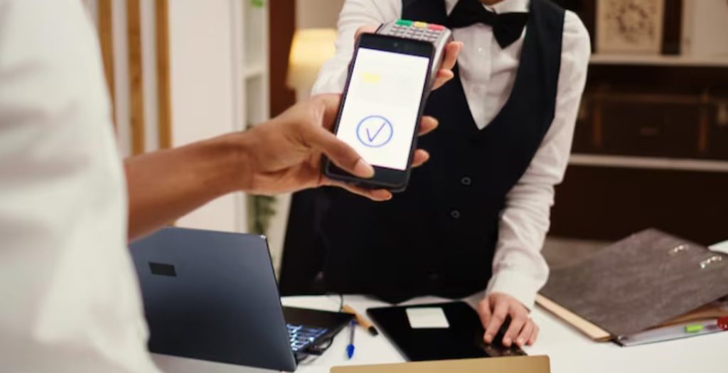 Modern hotel staff processing secure guest payments