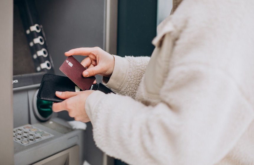 Customer using newly installed ATM machine successfully
