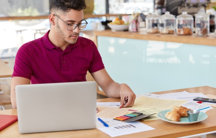 Business owner calculating accounting service costs carefully