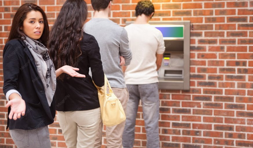 Customers using ATM for cash withdrawals securely