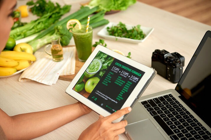 Tablet POS displaying digital menu in caf&eacute;