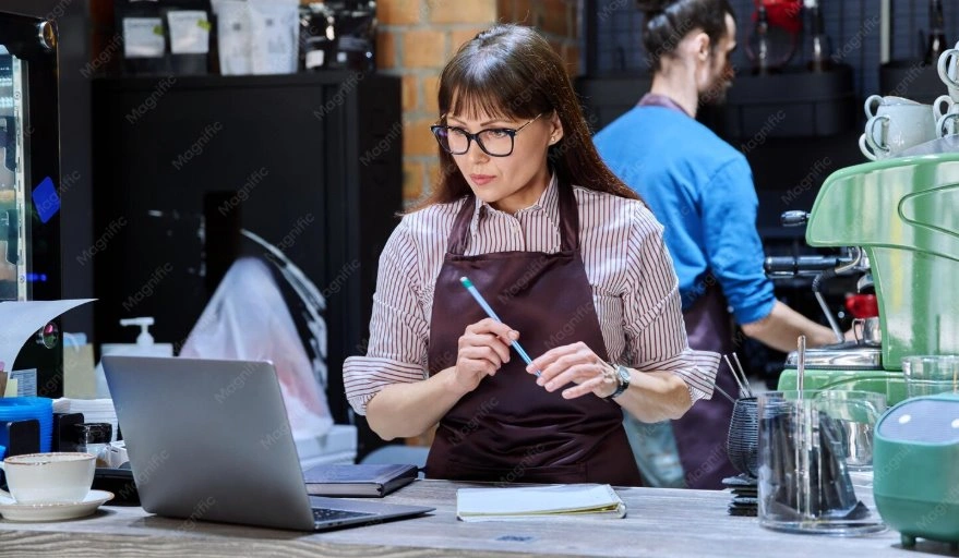 Small business owner using modern POS system