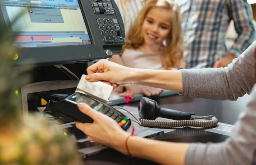 Customer making payment through secure POS terminal